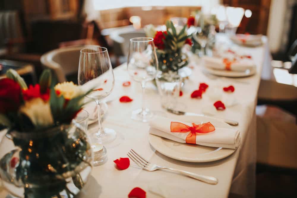 Wedding,Table,Setting,Decorated,With,Fresh,Flowers,And,Silverware.,Concept